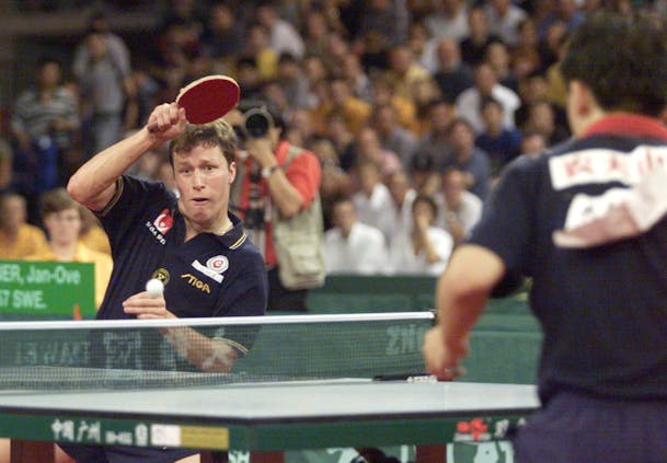 Swede Jan-Ove Waldner (L) smashes to China's Ma Lin (R) during semi-final at 1999 Table Tennis World Championships (Photo by JACQUES DEMARTHON/AFP via Getty Images)