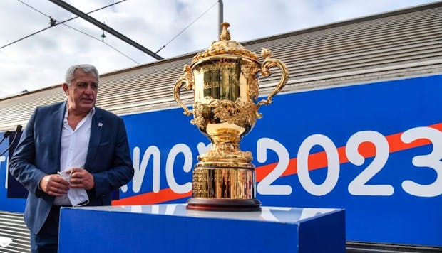 Claude Atcher, former CEO of the 2023 Rugby World Cup organising committee, with the Webb Ellis Cup (by ALAIN JOCARD/AFP via Getty Images)