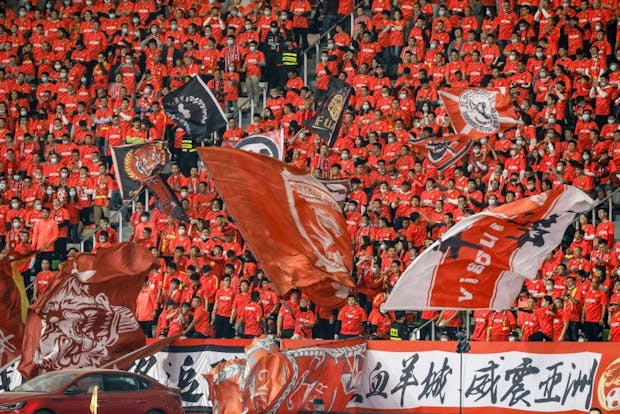 Supporters of CSL side Guangzhou Evergrande. (Photo by STR/AFP via Getty Images)