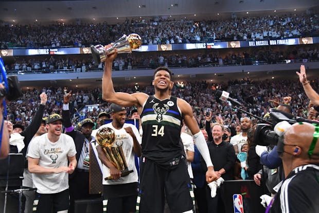Giannis Antetokounmpo of the Milwaukee Bucks celebrates after receiving the Bill Russell Finals MVP Award at the 2021 NBA Finals. (Credit: Getty Images)