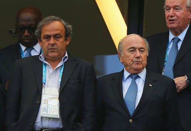 Michel Platini (L) and Joseph Blatter (R) at 2014 FIFA World Cup match in Salvador, Brazil (Photo by Martin Rose/Getty Images)