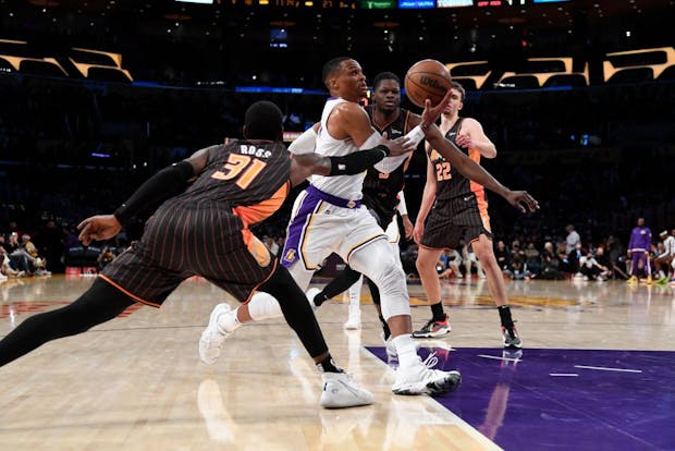 Russell Westbrook of the Los Angeles Lakers drives to the basket against Terrence Ross #31 of the Orlando Magic on December 12, 2021 (by Kevork Djansezian/Getty Images)