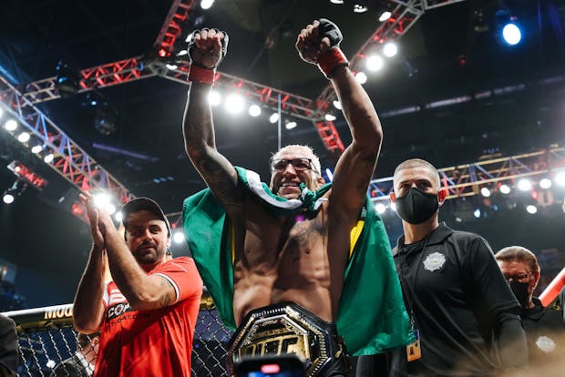 Charles Oliveira celebrates after defeating Dustin Poirier to defend his lightweight title during the UFC 269 event on December 11, 2021 (by Carmen Mandato/Getty Images)