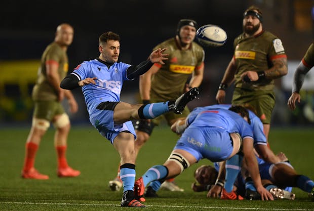 Tomos Williams of Cardiff box kicks during the Heineken Champions Cup match against Harlequins (Photo by Dan Mullan/Getty Images)