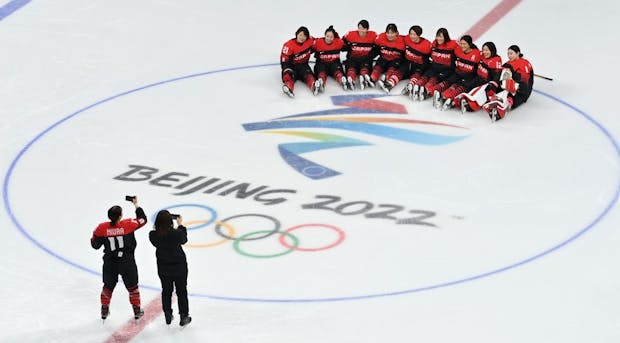 Athletes from Team Japan pose for pictures during practice at the Wukesong Sports Centre in preparation for the 2022 Beijing Winter Olympics. (Photo by Justin Setterfield/Getty Images)