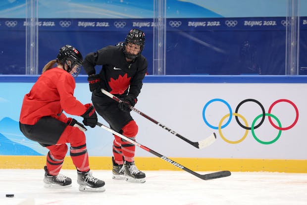 Ella Shelton and Melodie Daoust of Team Canada warm up during a practice session ahead of the Beijing 2022 Winter Olympics (Photo by Sarah Stier/Getty Images)