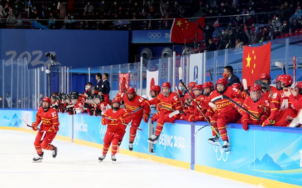 Team China celebrate victory over Team Japan during the Women's Preliminary Round Group B match at the 2022 Winter Olympic Games (by Bruce Bennett/Getty Images)