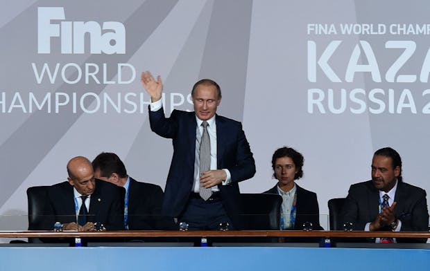 Vladimir Putin, President of Russia, waves during the opening ceremony of the 2015 Fina World Championships in Kazan (by Matthias Hangst/Getty Images)