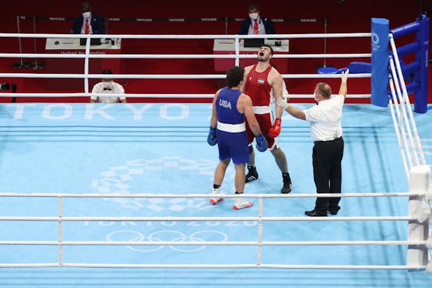 Bakhodir Jalolov (R) of Team Uzbekistan in action against Richard Torrez Jr of Team United States (L) during the men's super heavy (+91kg) final bout at the Tokyo 2020 Olympic Games (by Julian Finney/Getty Images)