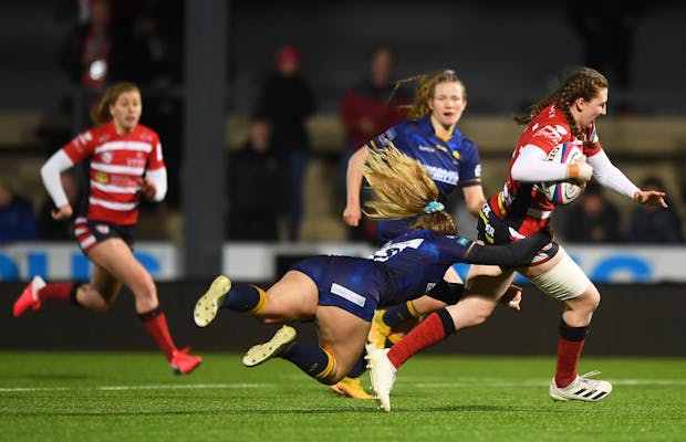 Emma Sing of Gloucester Hartpury is tackled by Sarah Nicholas of Worcester Warriors Women during the Premier 15s match on March 5, 2022 (by Harry Trump/Getty Images)