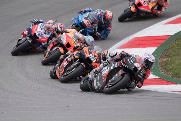 Aleix Espargaro of Aprilia Racing leads the field during the MotoGP Of Portugal - Race on April 24, 2022 (by Mirco Lazzari gp/Getty Images)