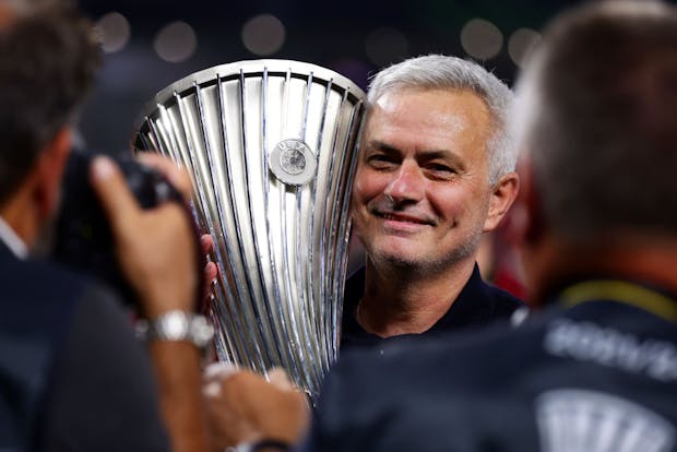 Roma manager Jose Mourinho celebrates with UEFA Europa Conference League Trophy (Photo by Alex Pantling/Getty Images)