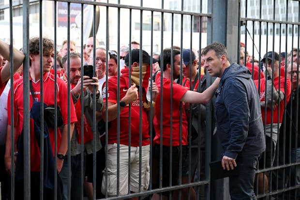 Liverpool fans react as they queue outside the Stade de France prior to the Uefa Champions League final on May 28, 2022 (by Matthias Hangst/Getty Images)