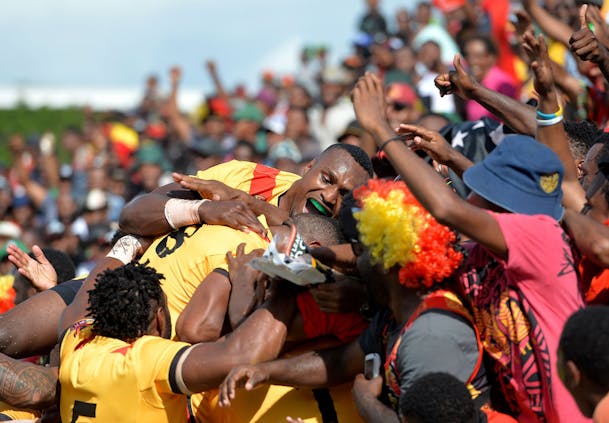 Lachlan Lam of Papua New Guinea celebrates scoring against the United States in Port Moresby. (Photo by Bradley Kanaris/Getty Images)