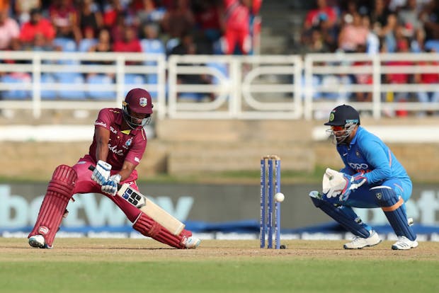 West Indies batsman Nicholas Pooran and India wicket-keeper Risabh Pant in action in Trinidad and Tobago. (Photo by Ashley Allen/Getty Images)
