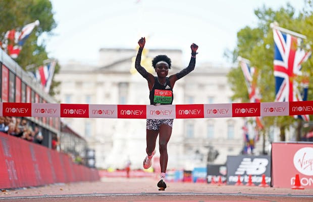 Joyciline Jepkosgei celebrates winning the women's elite race during the 2021 London Marathon (by Alex Davidson/Getty Images)