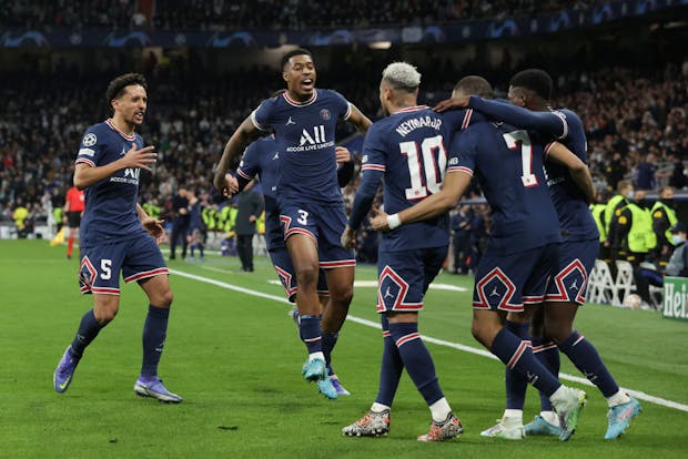 Kylian Mbappe (2ndR) of Paris Saint-Germain celebrates with teammates after scoring during the Uefa Champions League Round Of 16 match against Real Madrid on March 9, 2022 (by Gonzalo Arroyo Moreno/Getty Images)