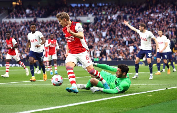 Arsenal's Norwegian international, Martin Ødegaard, controls the ball against Tottenham Hotspur during Premier League match (by Clive Rose/Getty Images)