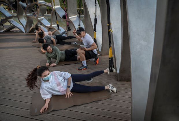 Gym culture has grown in China in recent years, encouraged by a government focus on citizens' health and fitness. (Photo by Kevin Frayer/Getty Images)