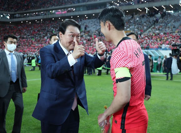 President Yoon Suk-yeol (L) and Son Heung-min at the friendly between South Korea and Brazil at Seoul World Cup Stadium, June 2022. (Photo by South Korean Presidential Office via Getty Images)