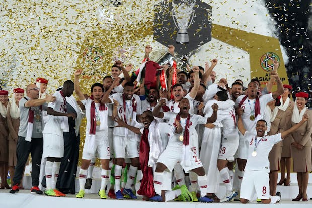 Qatar lifts the Asian Cup trophy following their victory over Japan in the 2019 final (by Koji Watanabe/Getty Images)