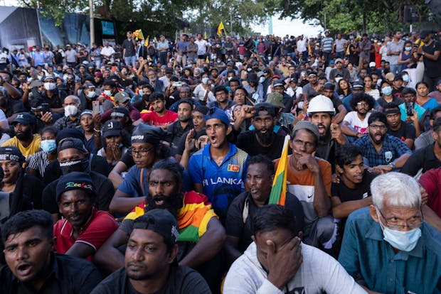 Protestors gather outside the residence of former Sri Lankan president Gotabaya Rajapaksa. (Photo by Buddhika Weerasinghe/Getty Images)