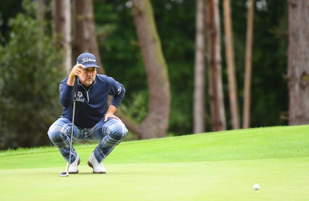 Ian Poulter lines up a putt on the second green during day one of the LIV Golf Invitational - London (Photo by Joe Maher/LIV Golf/Getty Images)