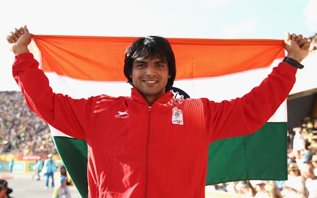 Neeraj Chopra of India celebrates winning gold in the men's javelin final at the Gold Coast 2018 Commonwealth Games (by Cameron Spencer/Getty Images)