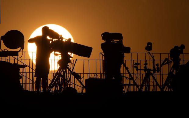 Television cameras silhouetted against setting sun during the 2019 Africa Cup of Nations in Cairo, Egypt (Photo by Visionhaus)
