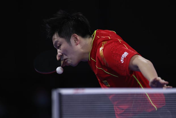 Fan Zhendong in action at the 2021 ITTF World Team Table Tennis Championships Finals. (Photo by Tim Warner/Getty Images)
