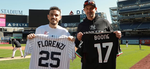 AC Milan fullback Alessandro Florenzi (l) and New York Yankees manager Aaron Boone. (AC Milan)
