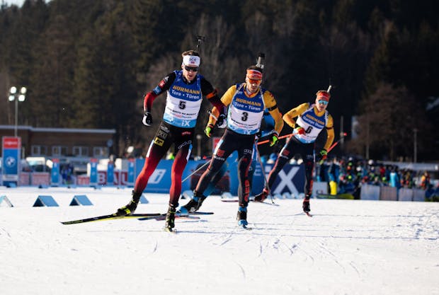 Tarjei Boe of Norway, Arnd Peiffer of Germany, and Benedikt Doll of Germany compete at the BMW IBU World Cup (Photo by Christian Manzoni/NordicFocus/Getty Images)