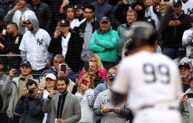 Fans at Yankee Stadium watching Aaron Judge, star outfielder for Major League Baseball's New York Yankees. (Photo by Elsa/Getty Images)