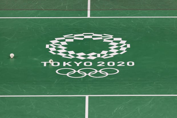 A general view of a badminton court with the Tokyo Olympic logo (by Lintao Zhang/Getty Images)