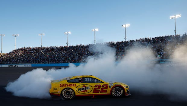 Joey Logano celebrates with a burnout after winning the 2022 NASCAR Cup Series Championship.
