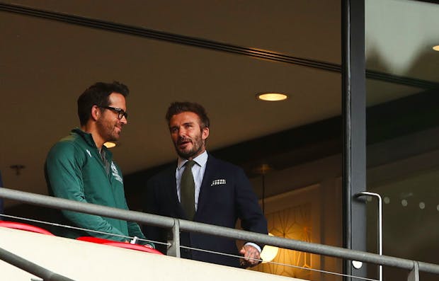 Ryan Reynolds (left) talks to global soccer star David Beckham (Credit: Getty Images)