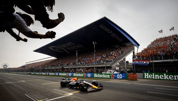 Max Verstappen of Red Bull Racing crosses the finish line to win the 2022 Dutch Grand Prix (by A