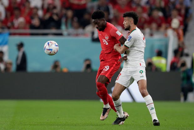 Alphonso Davies of Canada (L) during World Cup match against Morocco on December 1, 2022 (Photo by Eric Verhoeven/Soccrates/Getty Images)