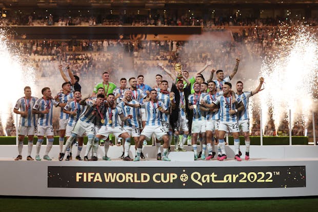 Lionel Messi of Argentina lifts the Fifa World Cup trophy (Photo by Matthew Ashton - AMA/Getty Images)