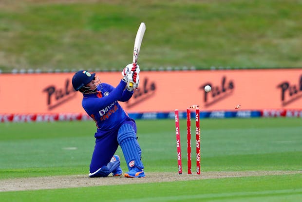 Indian player Richa Ghosh is bowled by New Zealand's Sophie Devine (Photo by James Allan/Getty Images)