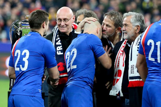 President of the French Rugby Federation, Bernard Laporte (second from left), following the Six Nations match between France and England on March 19, 2022 (by John Berry/Getty Images)