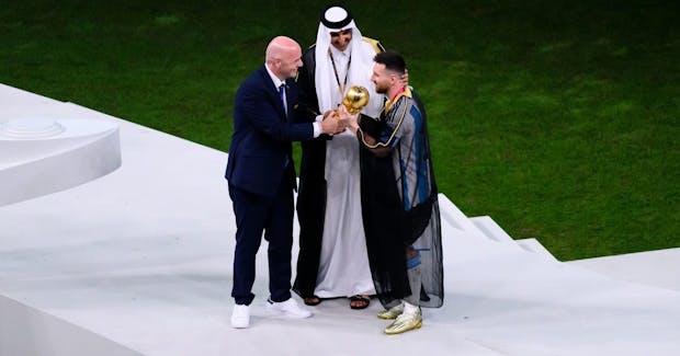 Fifa president GIanni Infantino presents the World Cup to Argentina captain Lionel Messi