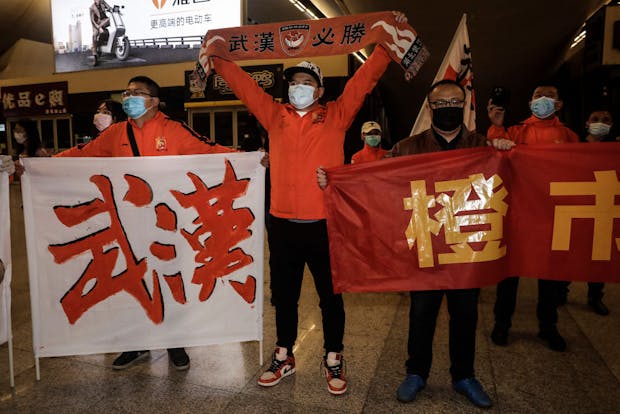 Supporters of Wuhan Zall welcome the team home in April 2020 after they were stranded in Spain by the Covid-19 pandemic outbreak.(Photo by Getty Images)