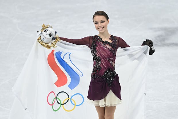 Gold medallist Anna Shcherbakova of Team ROC celebrates during the Women's Single Skating Free Skating flower ceremony at the Beijing 2022 Winter Olympic Games (by David Ramos/Getty Images)
