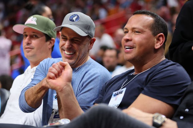 Marc Lore (middle) and Alex Rodriguez (right) watch a Minnesota Timberwolves game together (Getty Images)