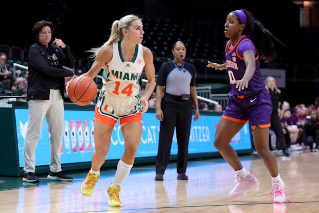 Haley Cavinder of the Miami Hurricanes with coach Katie Meier in the background (Getty Images)