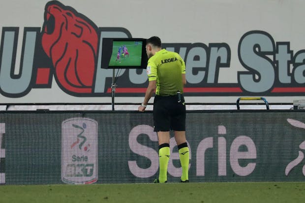 Referee Eugenio Abbattista inspects the VAR screen before awarding Perugia a penalty in a Serie B match against AC Monza in January (Giuseppe Cottini/Getty Images)