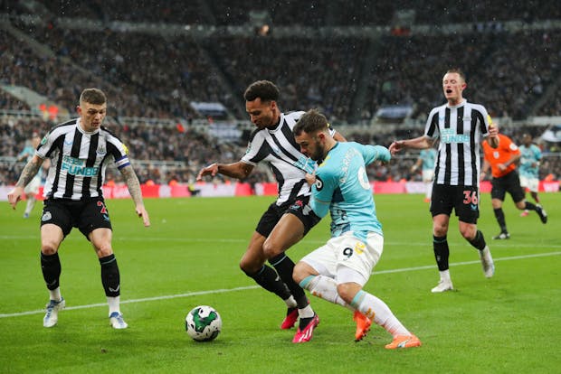 Adam Armstrong of Southampton battles for possession against Newcastle United during 2022-23 Carabao Cup semi-final (by James Gill - Danehouse/Getty Images)