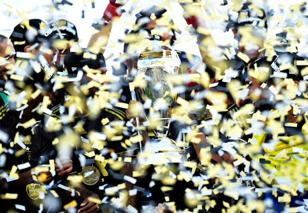 The Philip F. Anschutz Trophy is seen through the confetti after the Los Angeles FC defeated the Philadelphia Union during the 2022 MLS Cup Final (Getty Images)