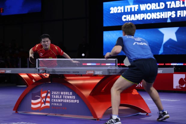 Fan Zhendong of China plays a shot against Truls Moregard of Sweden (Photo by Tim Warner/Getty Images)